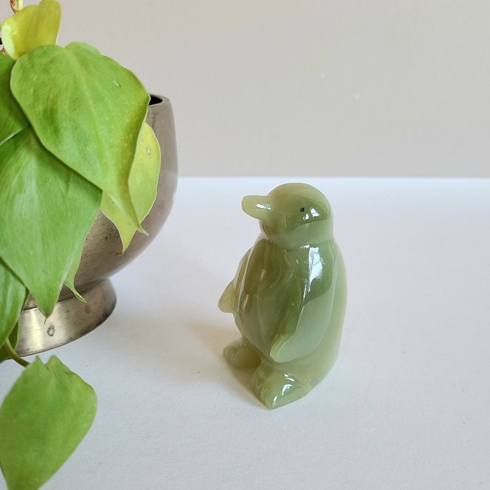 Stone penguin figurine.